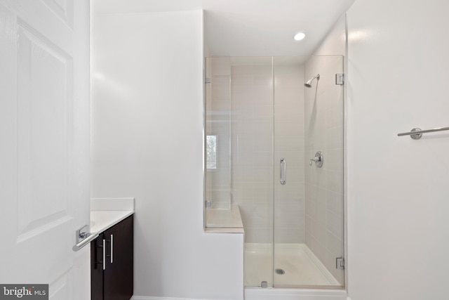 bathroom with vanity and walk in shower