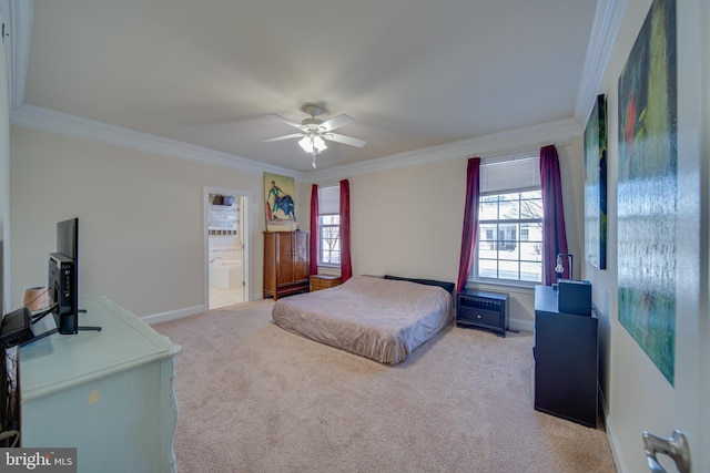 carpeted bedroom with multiple windows, ensuite bathroom, ceiling fan, and ornamental molding