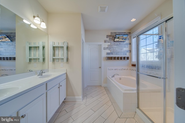 bathroom featuring vanity and plus walk in shower