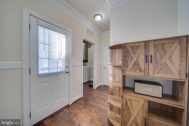 entryway with dark hardwood / wood-style floors, washer / clothes dryer, and ornamental molding