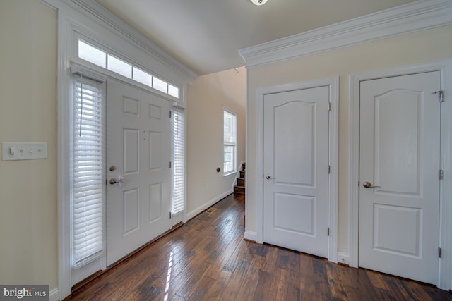 entryway featuring dark hardwood / wood-style flooring and ornamental molding