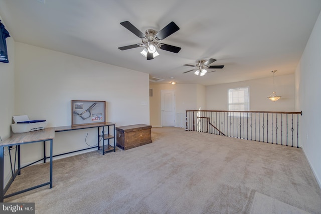 carpeted empty room with ceiling fan