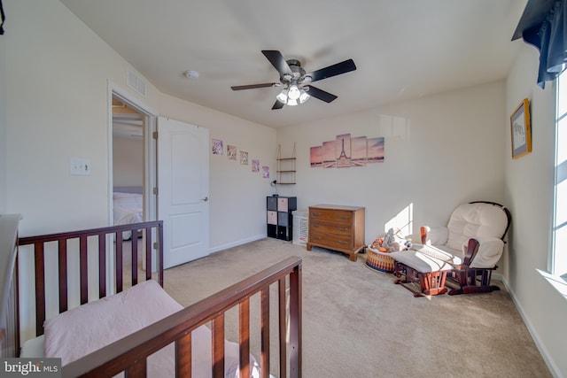 carpeted bedroom with ceiling fan