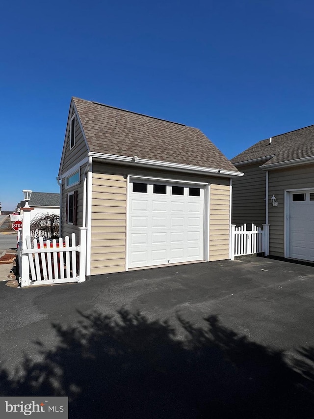 detached garage with fence