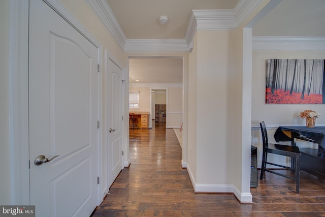 corridor with dark wood-type flooring and ornamental molding