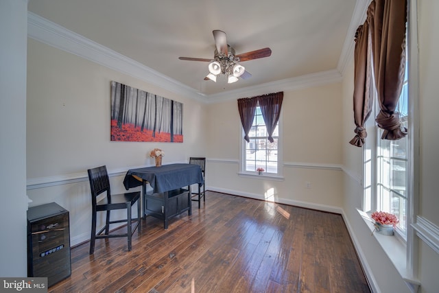 dining space with ceiling fan, crown molding, and dark wood-type flooring