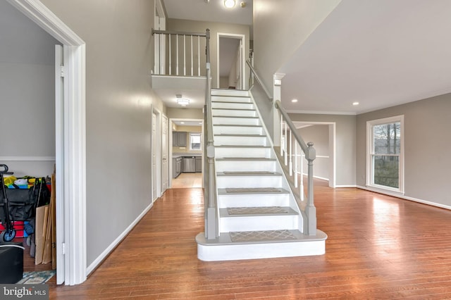 staircase featuring wood-type flooring