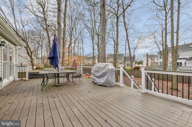 wooden terrace featuring grilling area