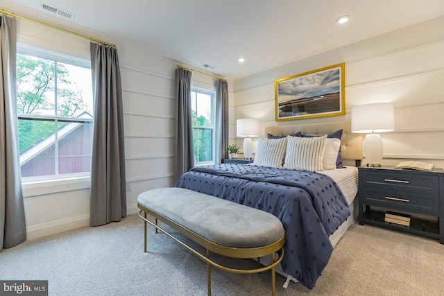 bedroom with light colored carpet