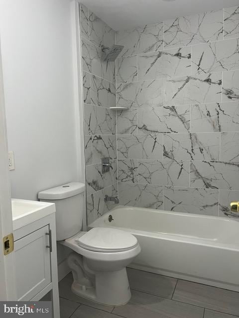 full bathroom with vanity, toilet, and tub / shower combination