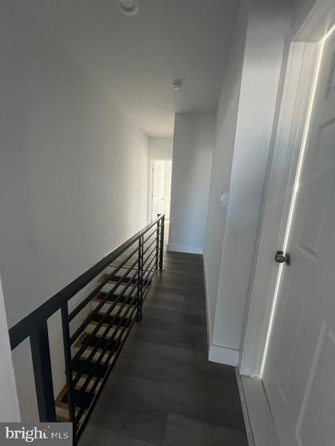 hall with dark hardwood / wood-style floors