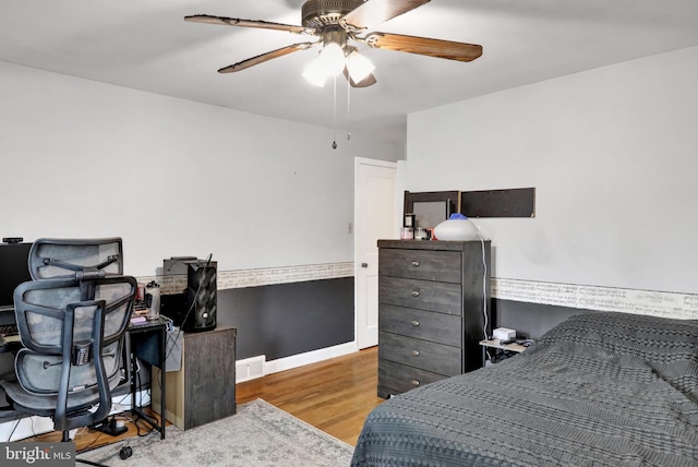 bedroom featuring ceiling fan and hardwood / wood-style floors