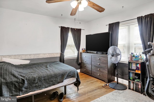 bedroom featuring light hardwood / wood-style flooring and ceiling fan