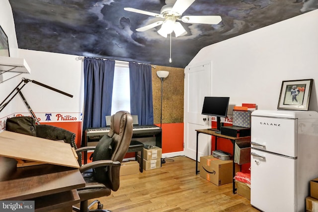 office featuring wood-type flooring, vaulted ceiling, and ceiling fan