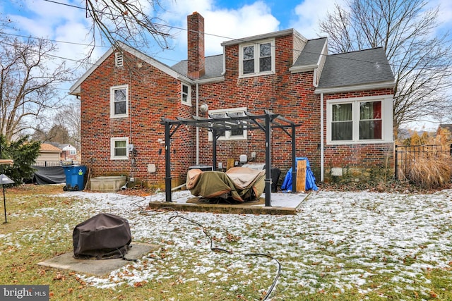 snow covered house with a pergola