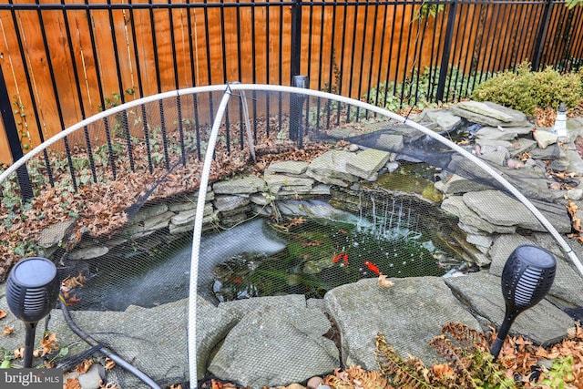 exterior details featuring a garden pond