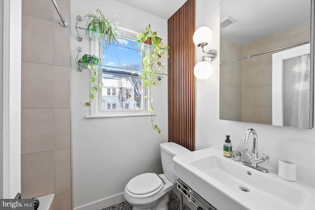 bathroom featuring toilet and sink