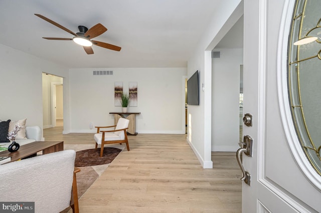 interior space with ceiling fan and light hardwood / wood-style flooring