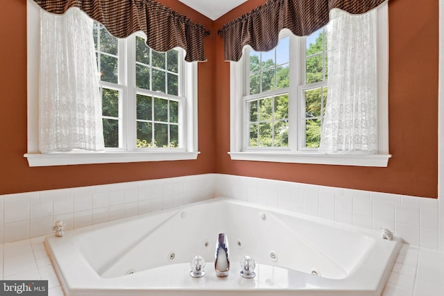 bathroom with tiled tub