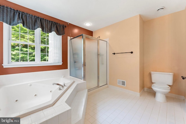 bathroom with tile patterned floors, toilet, and independent shower and bath