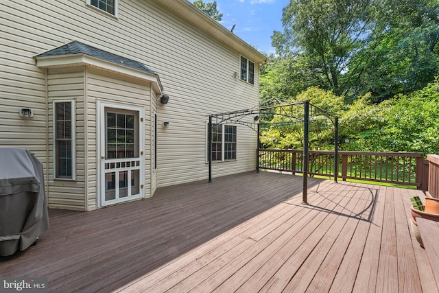 wooden terrace with area for grilling