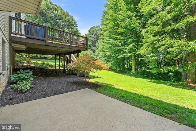 view of yard with a patio area and a deck