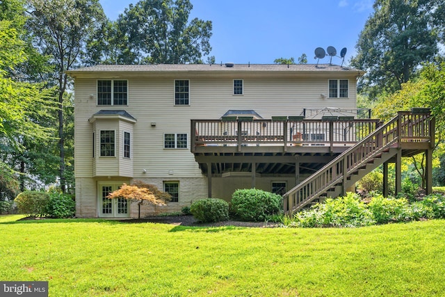 back of property featuring a lawn and a deck