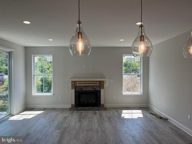 unfurnished living room featuring hardwood / wood-style floors