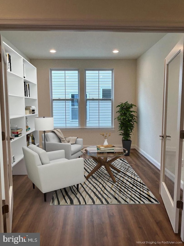 living room featuring french doors, dark hardwood / wood-style floors, and built in features