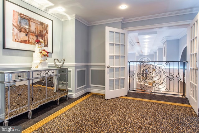 interior space with french doors and ornamental molding