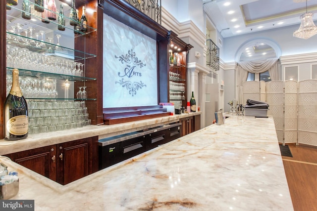 bar featuring hardwood / wood-style flooring