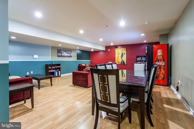 dining space with light hardwood / wood-style flooring