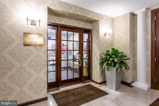 entryway with ornate columns