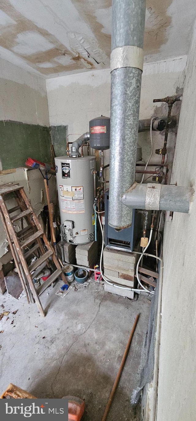 utility room featuring water heater