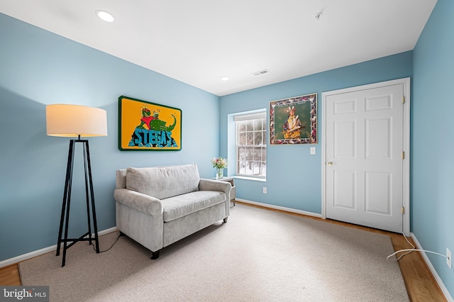 living area featuring carpet flooring