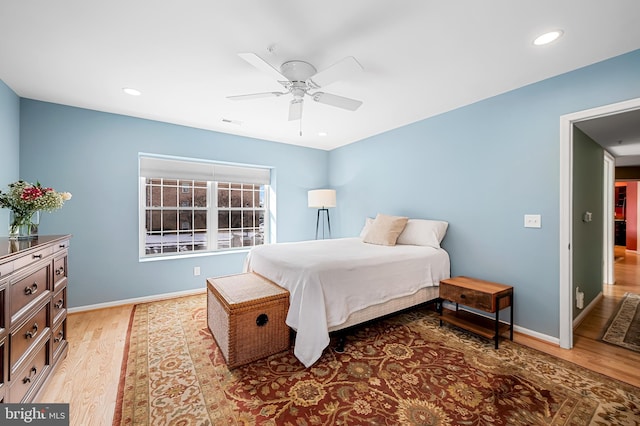 bedroom featuring light wood-type flooring and ceiling fan