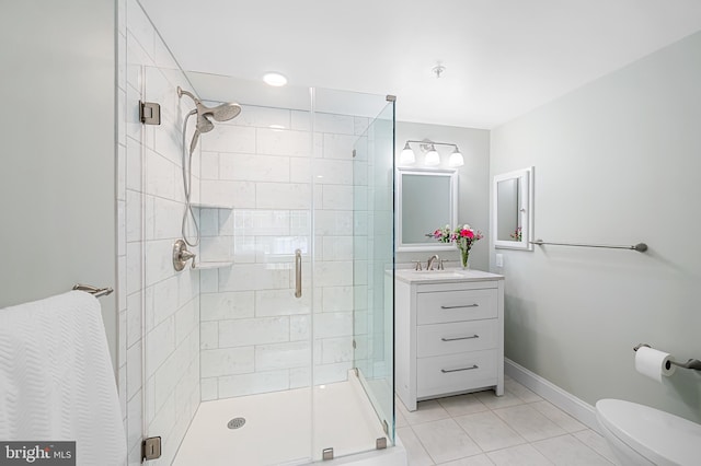 bathroom with vanity, toilet, tile patterned flooring, and walk in shower