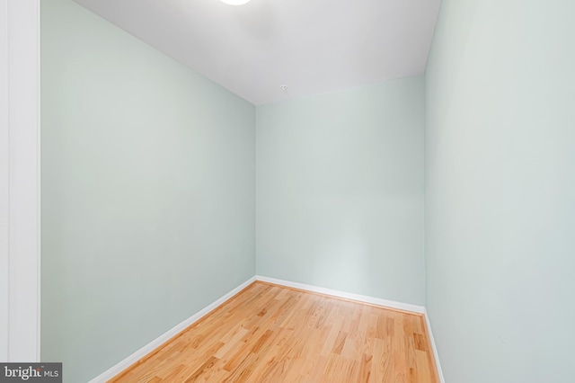 empty room with hardwood / wood-style floors