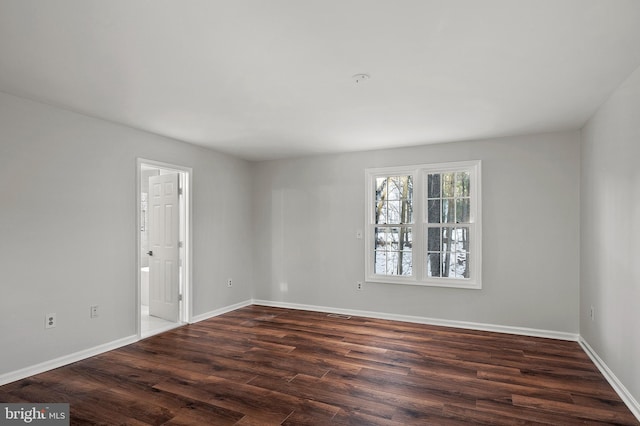 unfurnished room featuring dark hardwood / wood-style floors