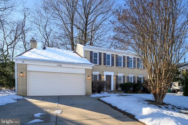 colonial-style house featuring a garage