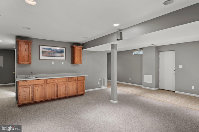 kitchen with light colored carpet and sink