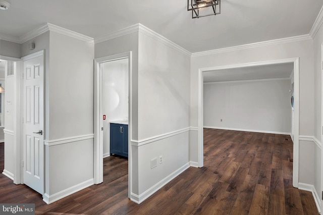 hall featuring ornamental molding and dark hardwood / wood-style flooring