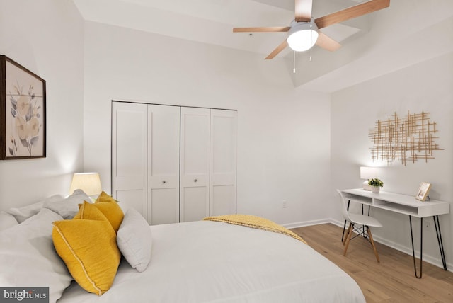 bedroom with a closet and light hardwood / wood-style flooring