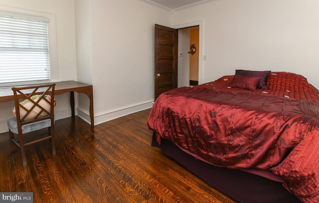 bedroom featuring dark hardwood / wood-style floors and ornamental molding