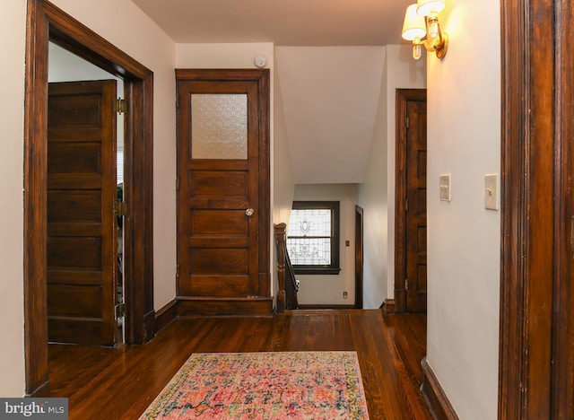 corridor featuring dark hardwood / wood-style flooring