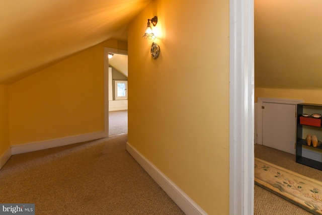 bonus room featuring carpet floors and vaulted ceiling