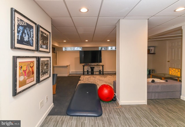 workout area featuring baseboard heating