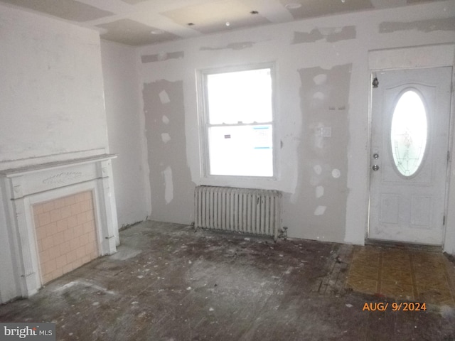 unfurnished living room with radiator