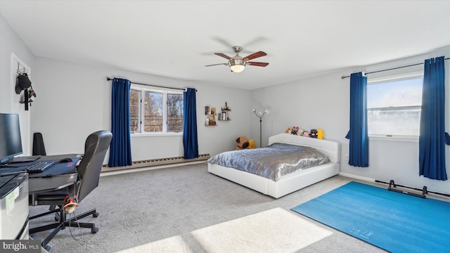 carpeted bedroom with ceiling fan and baseboard heating