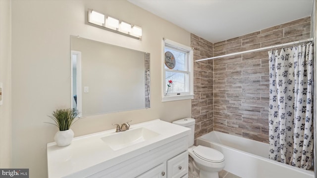 full bathroom featuring shower / tub combo, vanity, and toilet